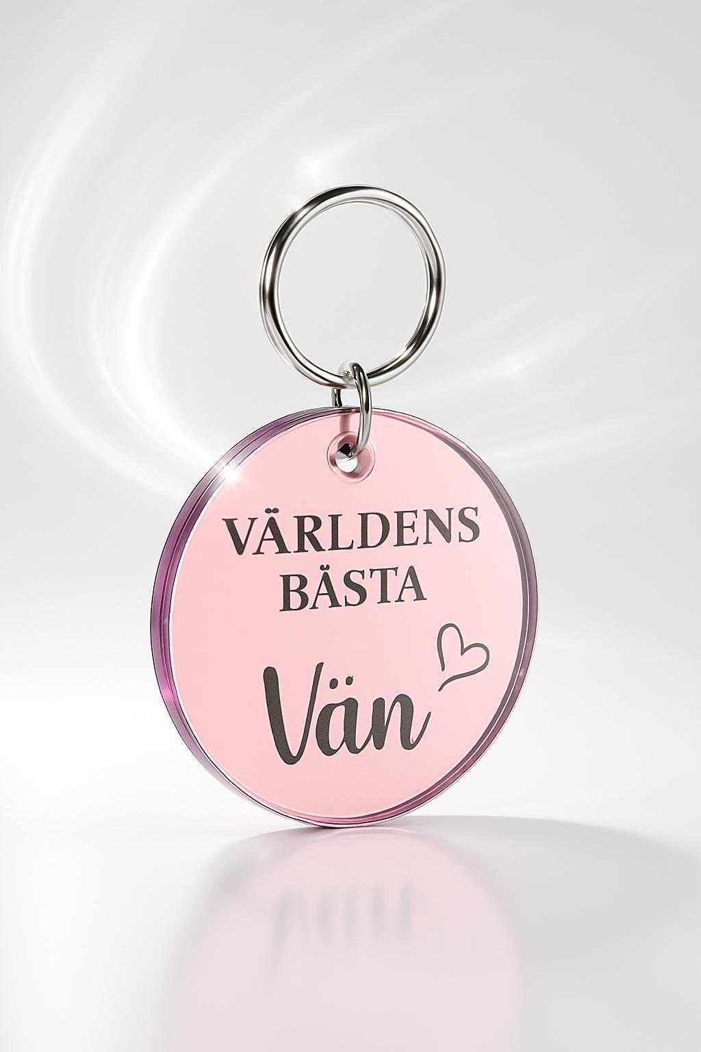 rund rosa nyckelring i spegelplast med texten världens bästa vän