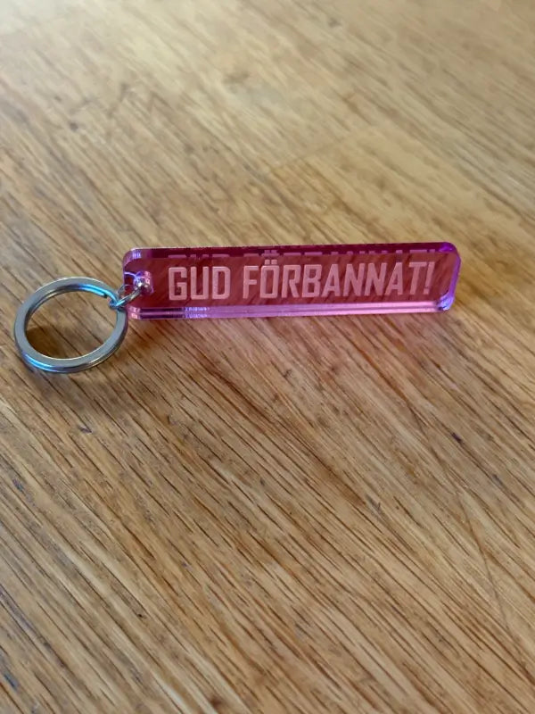 Nyckelring | “Gud förbannat” i Rosa spegelplast - Expresspresenter.se