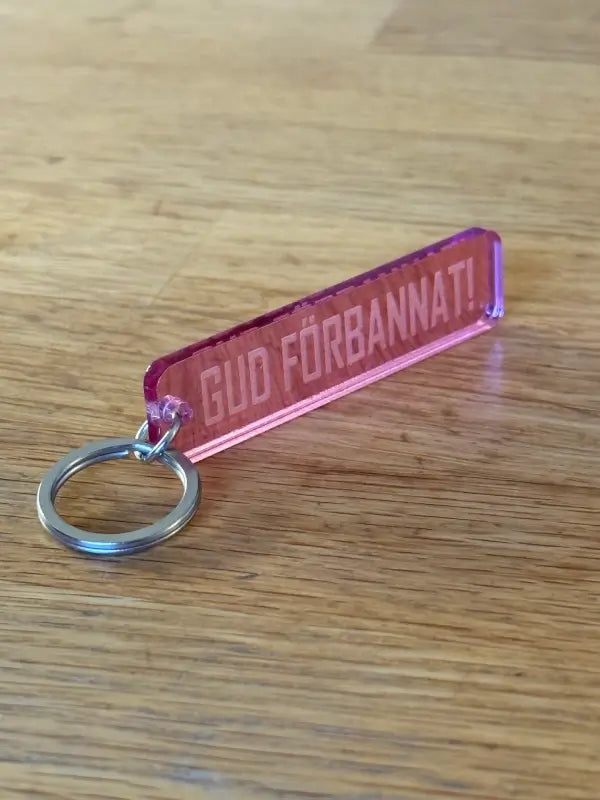 Nyckelring | “Gud förbannat” i Rosa spegelplast - Expresspresenter.se