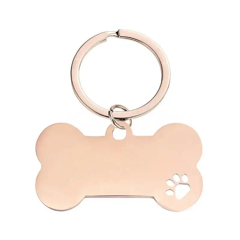 Nyckelring | Hundben Best friends for ever by Express-presenter är en nyckelring i guld med ett litet tassavtryck utskuret på nedre högra sidan - perfekt för djurälskare.