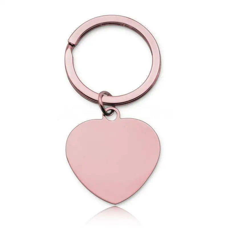Nyckelring i roséguld från Express-presenter, med ett slätt hjärtformat rostfritt stål-hänge, Kämpa du klarar detta, mot vit bakgrund.