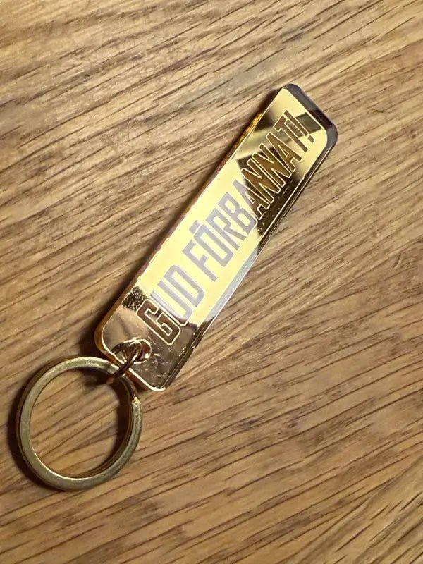 Nyckelring | Gud förbannat i spegelplast - Express - presenter